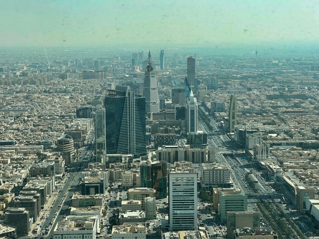 an aerial view of a city with tall buildings